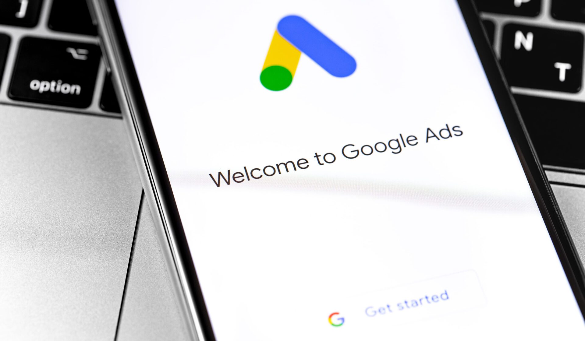 Google Ads logo on the screen smartphone background closeup